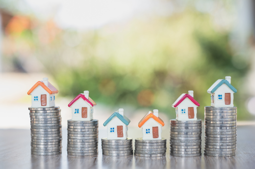 House on the stairs, coin, concept, starting a business Mortgages and real estate investments Saving money Investment risk.