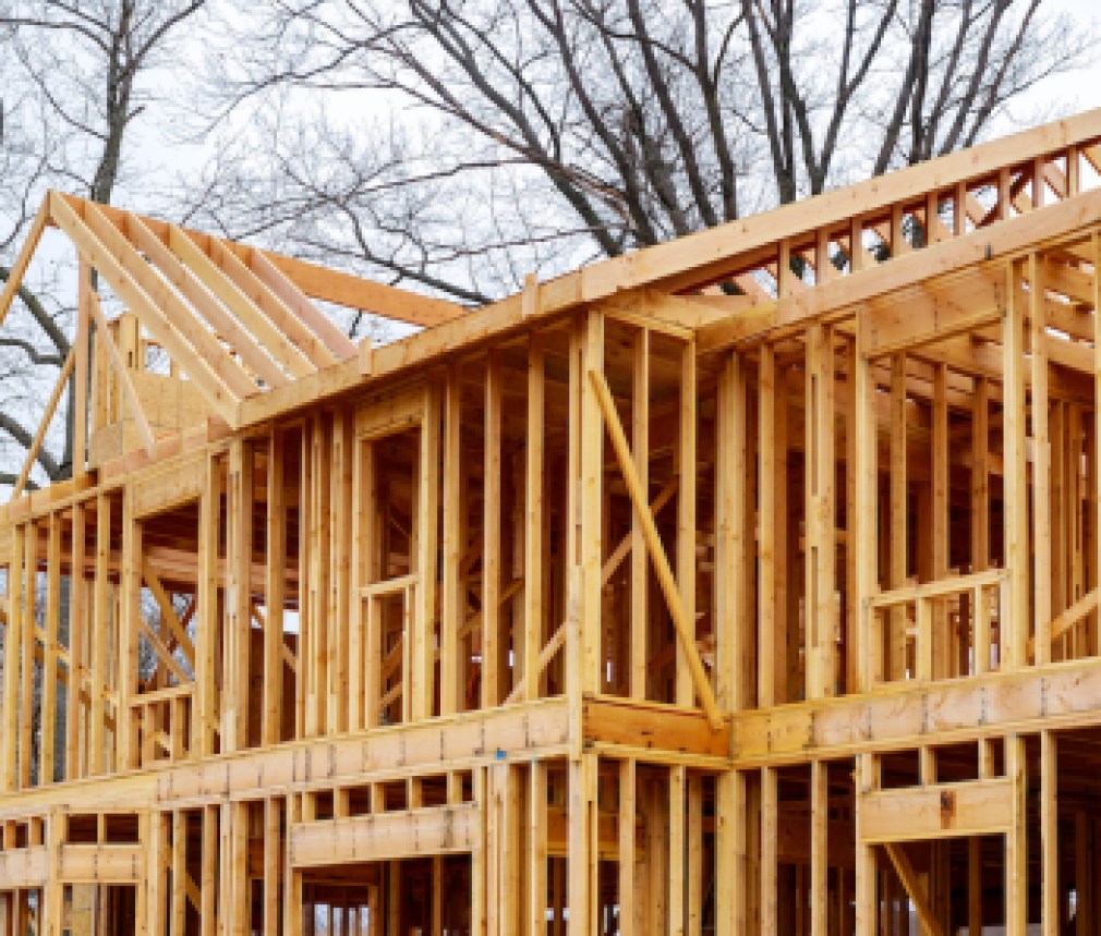 wood framework of new residential home under construction.