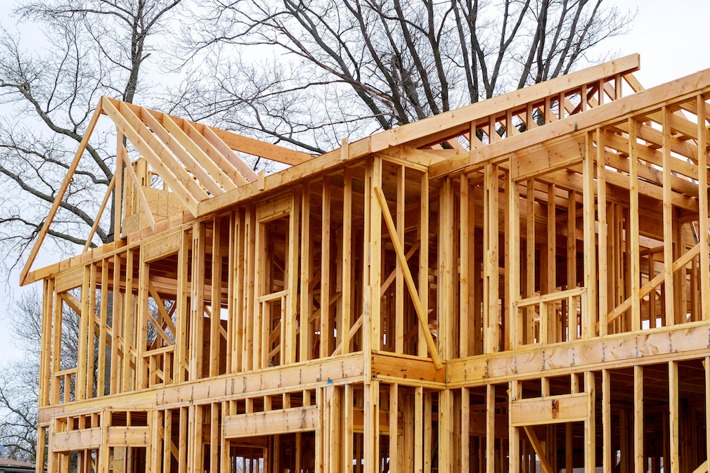 wood framework of new residential home under construction.
