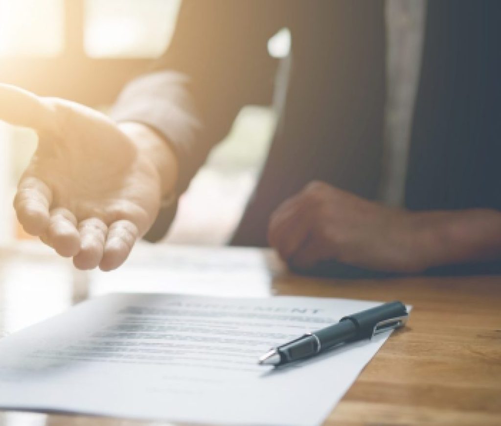 Real estate agent offer hand for customer sign aggrement contract signature. Real estate concept closing