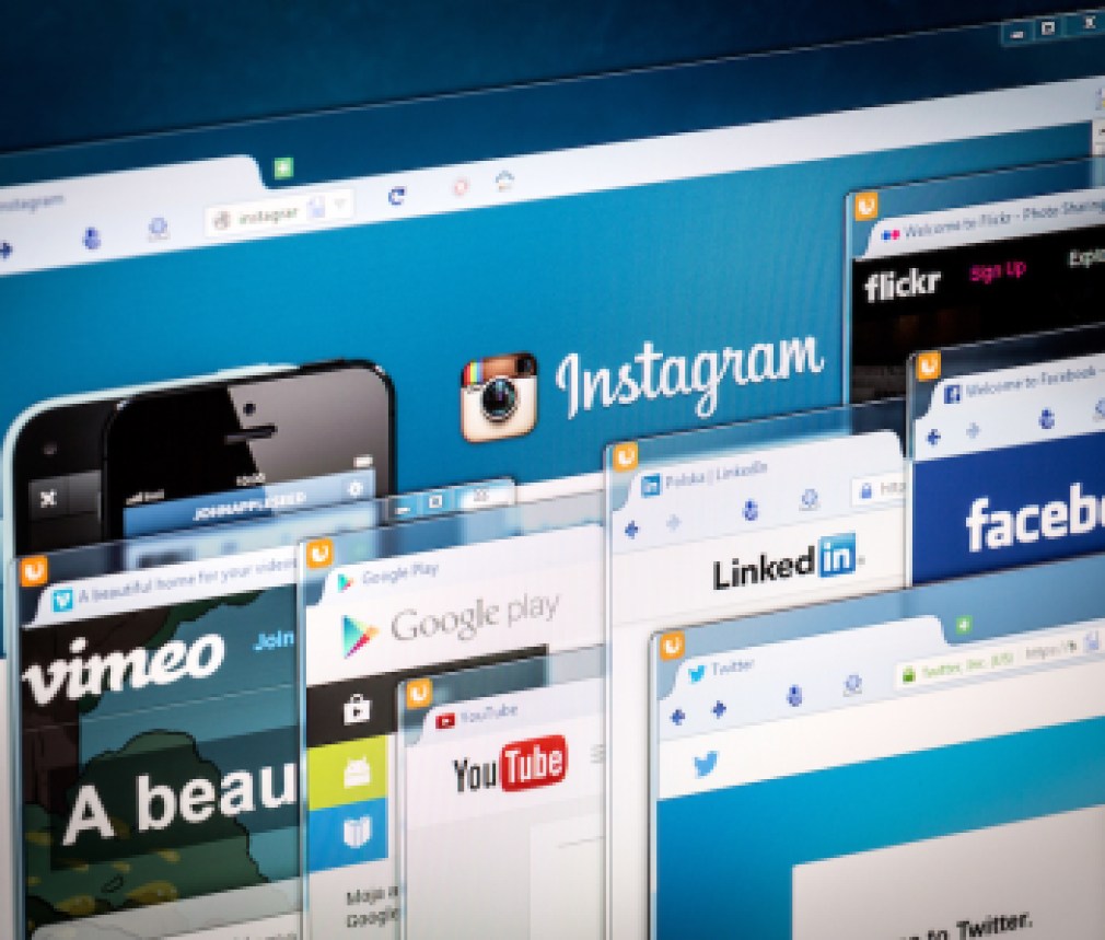 Social network homepage on a monitor screen.