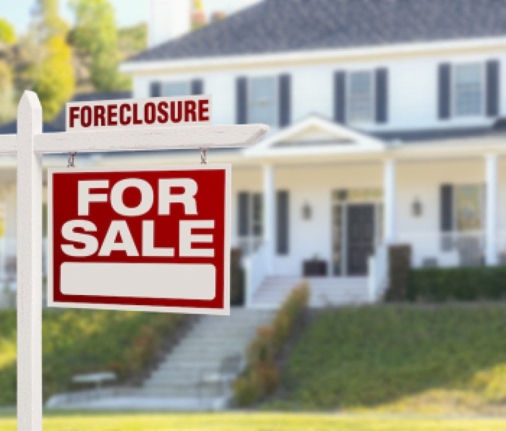 Foreclosure Home For Sale Real Estate Sign in Front of Beautiful Majestic House.