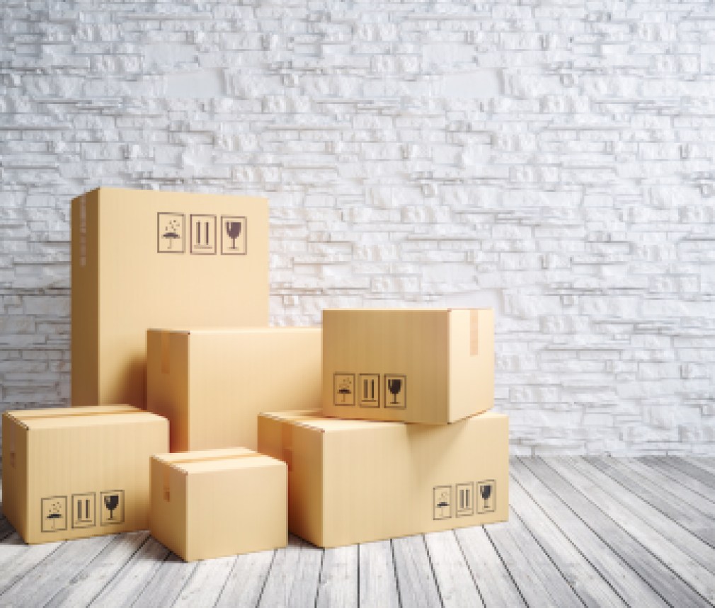Cardboard moving boxes in new home.