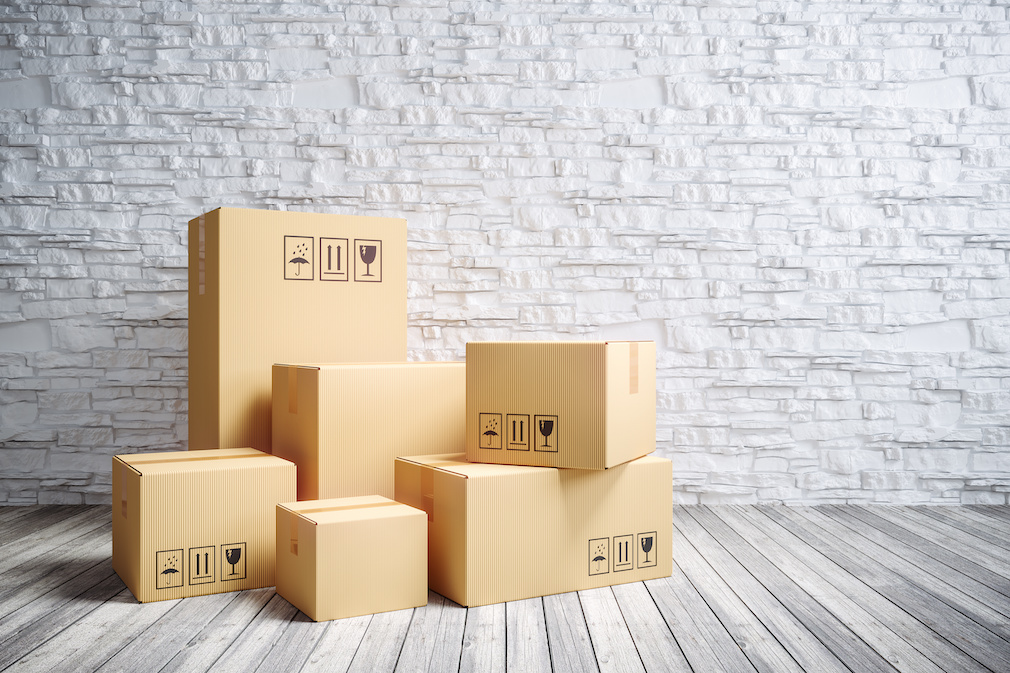 Cardboard moving boxes in new home.