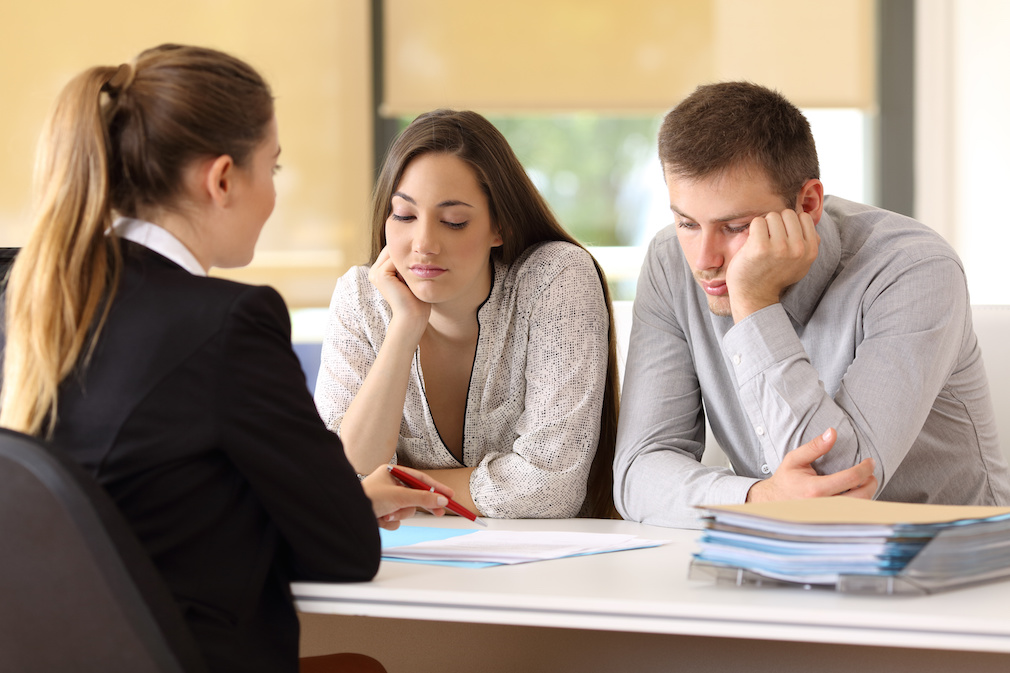 Bad saleswoman with unconvinced customers