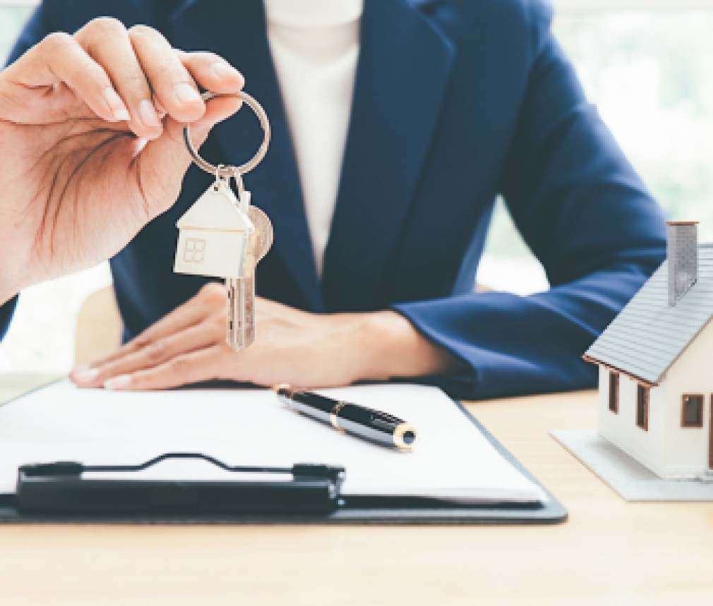House model with real estate agent and customer discussing for contract to buy house, insurance or loan real estate background.