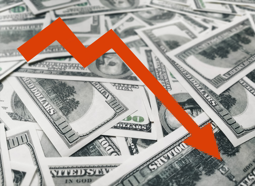 The light red arrow icon on a background of money . The concept of changing course of dollar on the market. Devaluation, collapse, stagnation of the economy.