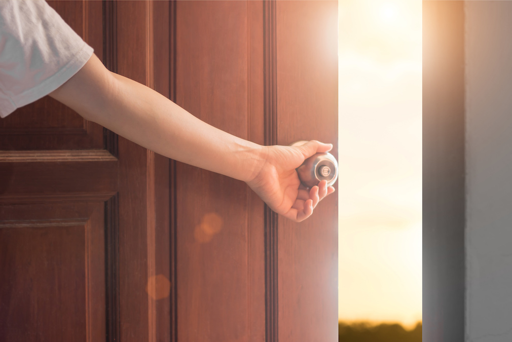 Women hand open door knob or opening the door,grand opening,Close up hand open door.