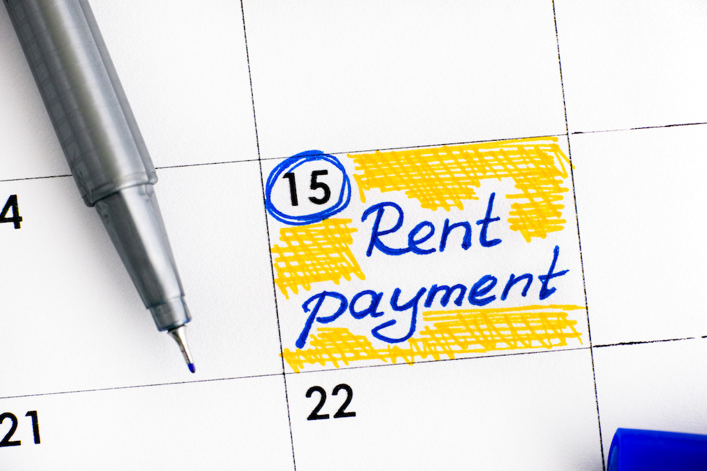 Reminder Rent Payment in calendar with blue pen.