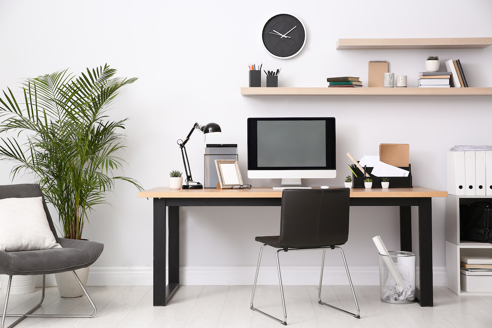 Modern computer on table in office interior. Stylish workplace