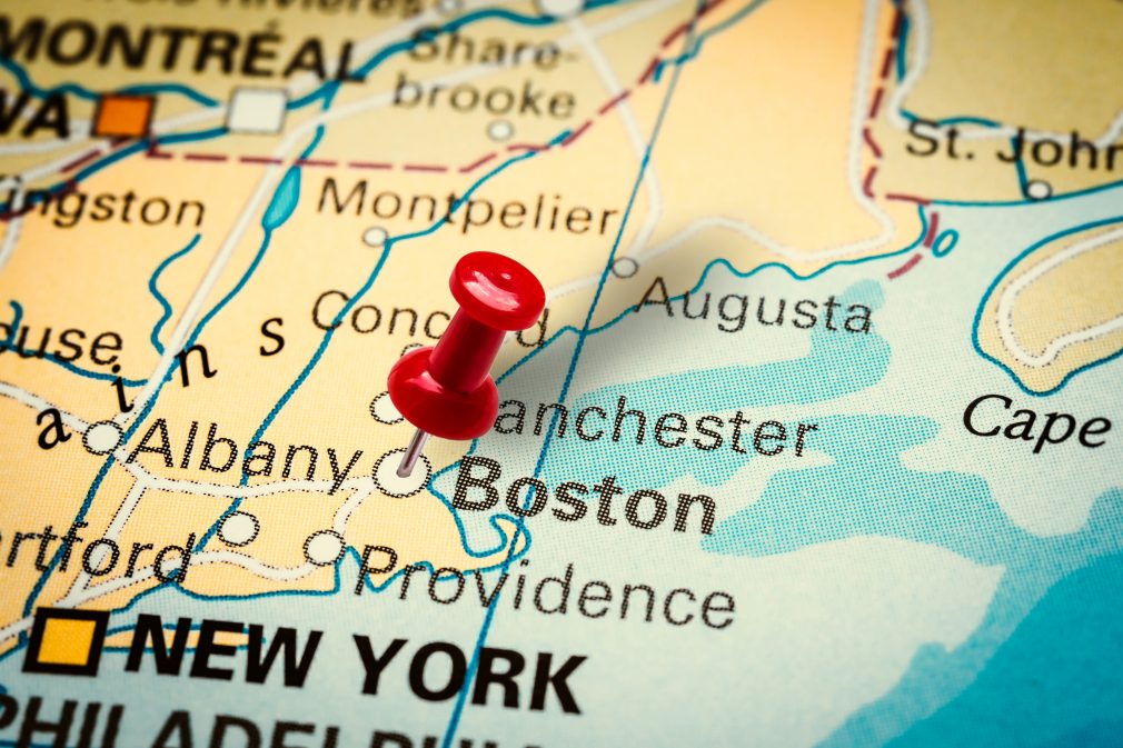 Pushpin pointing at Boston city in Massachusetts, America