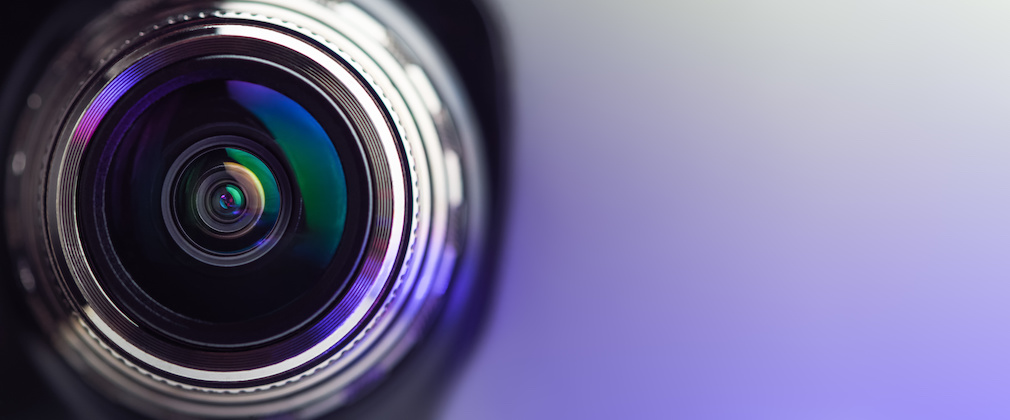 Banner. The camera lens with purple backlight. Optics.