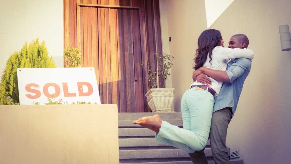 Happy couple after buying new house