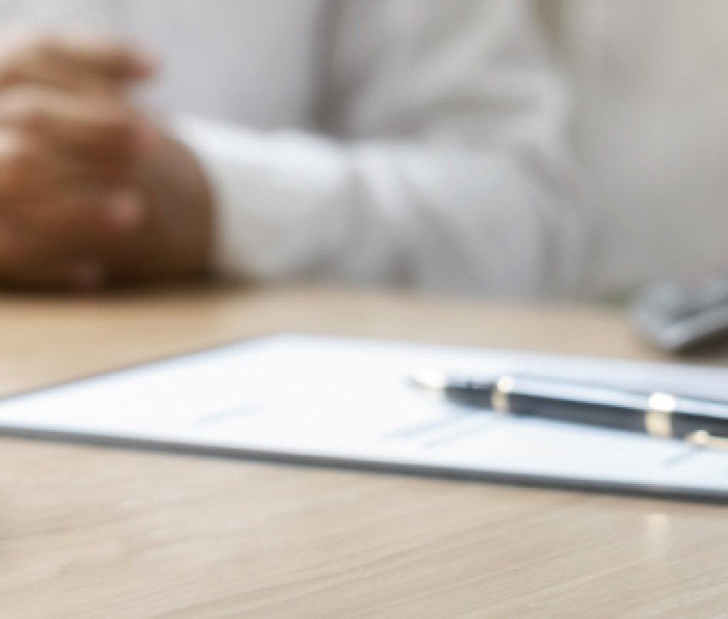 House model with agent and customer discussing for contract to buy, get insurance or loan real estate or property.