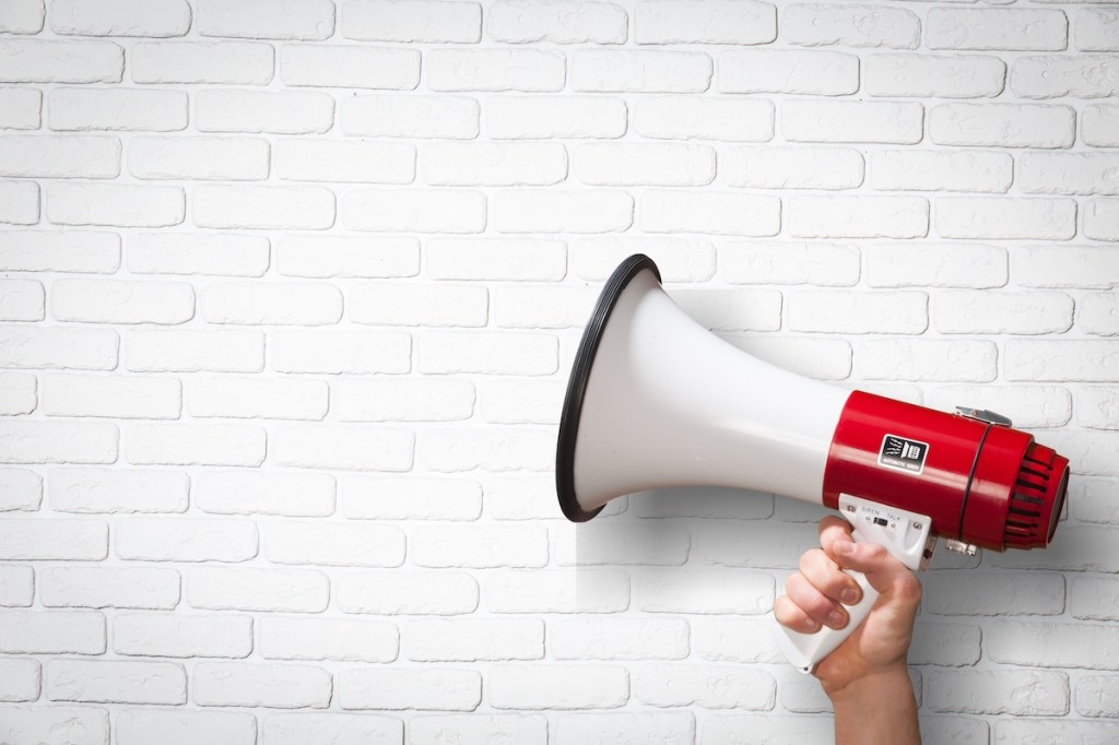 Human hand hold the classic megaphone