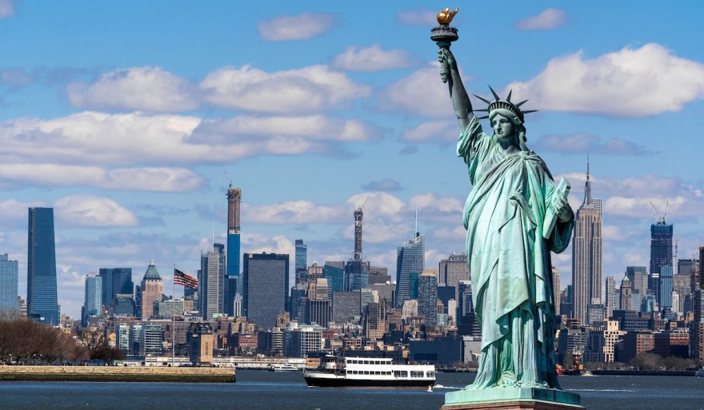 The Statue of Liberty over the Scene of New york cityscape river side which location is lower manhattan,Architecture and building with tourist concept