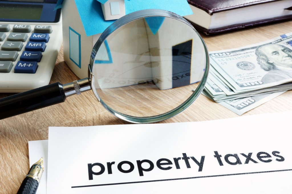 Document with title Property tax on a desk.