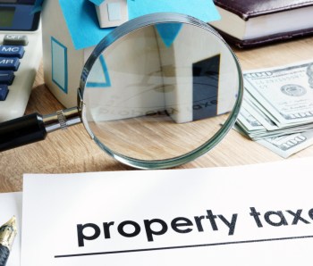 Document with title Property tax on a desk.