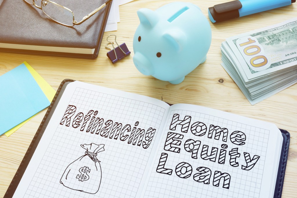 Refinancing vs. Home Equity Loan is shown on the conceptual photo