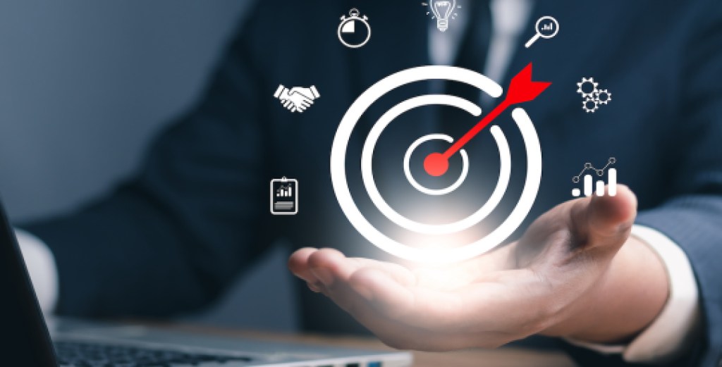 Concept of business strategy and future sustainable business finance action plan. Hand holding target board for creative and set up business objective target and success and business goals concept..
