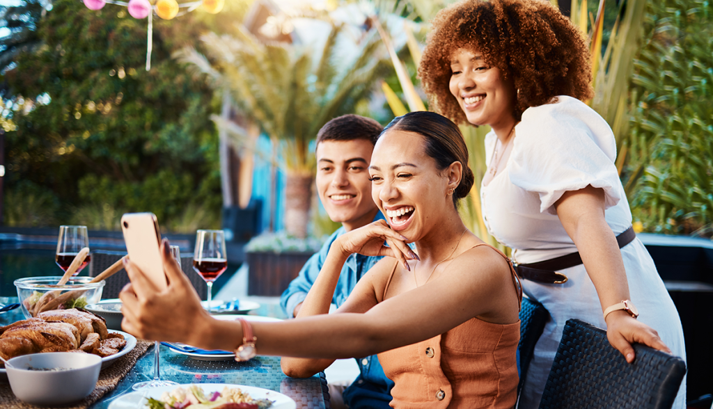 Group-of-young-adults-socializing-and-taking-a-selfie