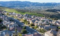 birds-eye view of high income single-family home mountain neighborhood