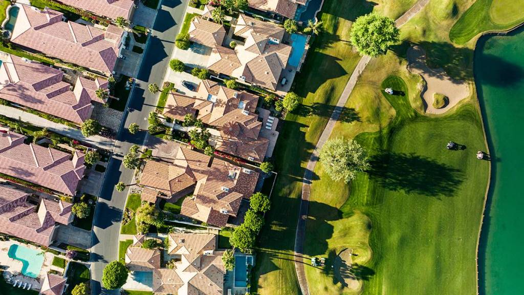 Resort or golf course real estate niche; pictured: Homes on a golf course (aerial view)