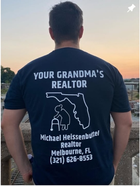 Man wearing shirt with logo, contact information and words "Your Grandma's Realtor