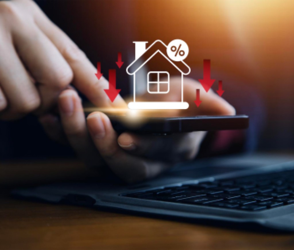 Businessman use smartphone with virtual home icon and down arrow for economical real estate and lower mortgage interest rates. Reduced prices for rental housing, Demand for home purchases decreases.