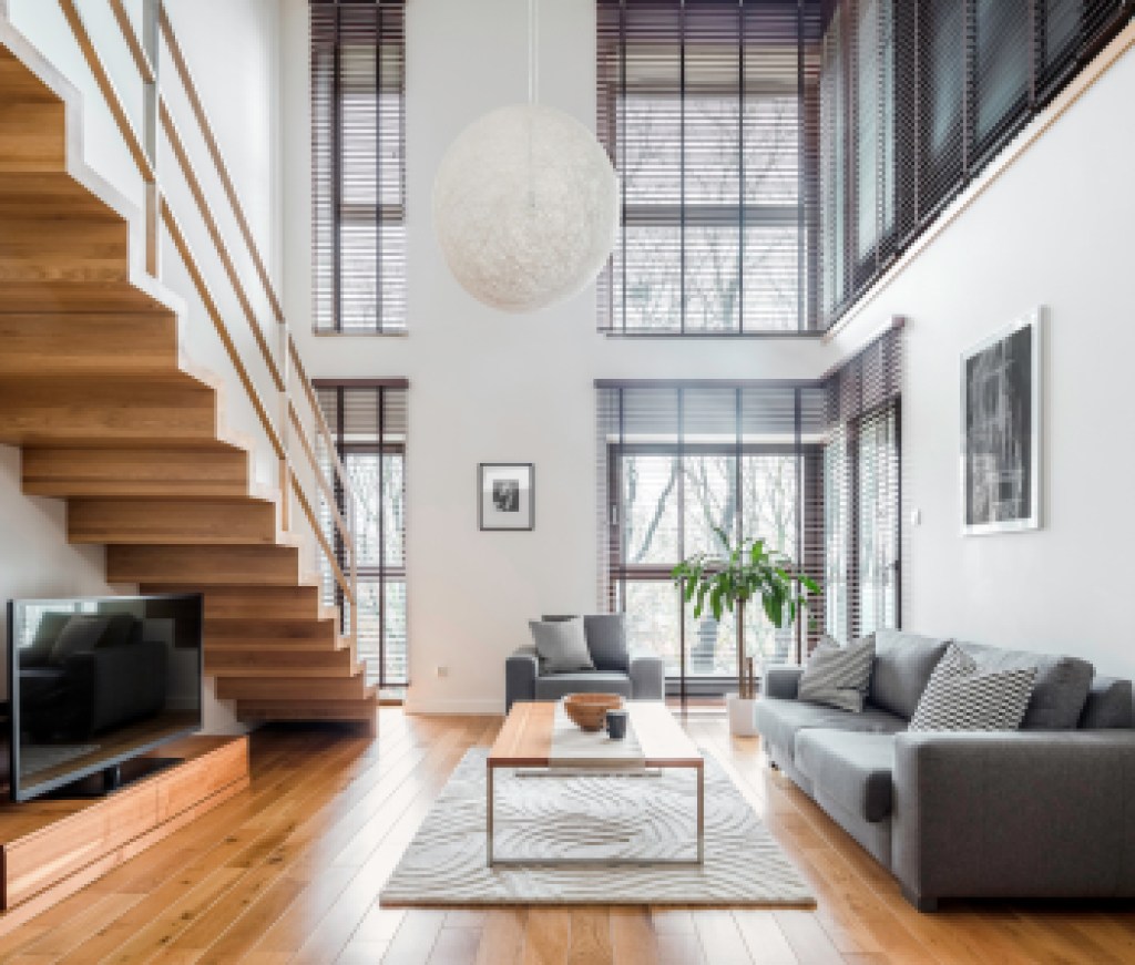 Spacious living room with wooden stairs